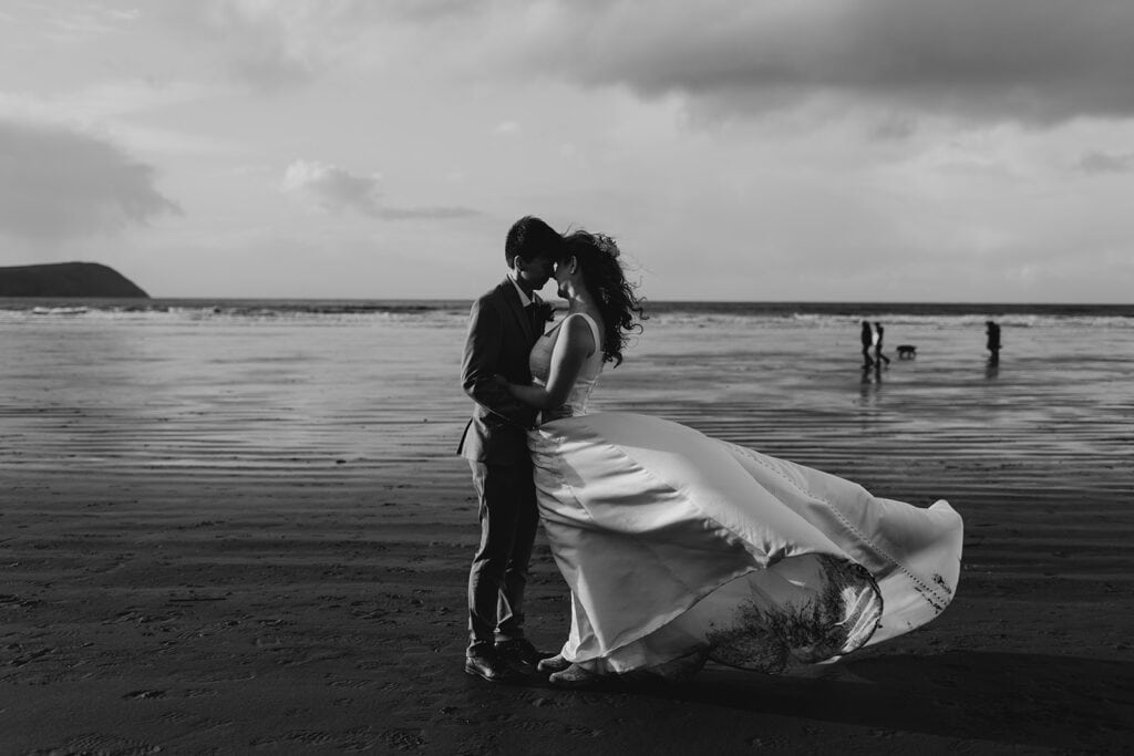 nantwen elopement couple kiss on beach